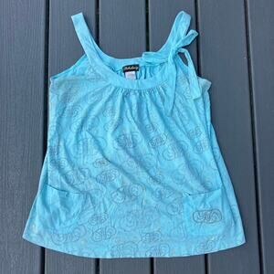 Blue tank top with swirl print and gold starbursts, bow tie, coquette cutecore